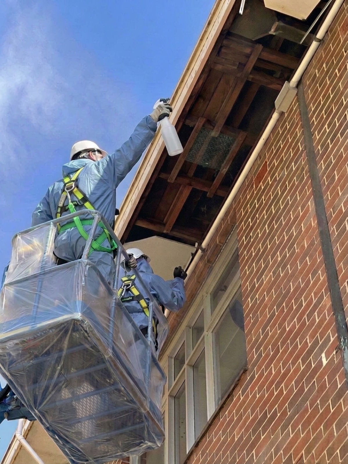 Crew removing asbestos eaves from an elevated platform, Burwood