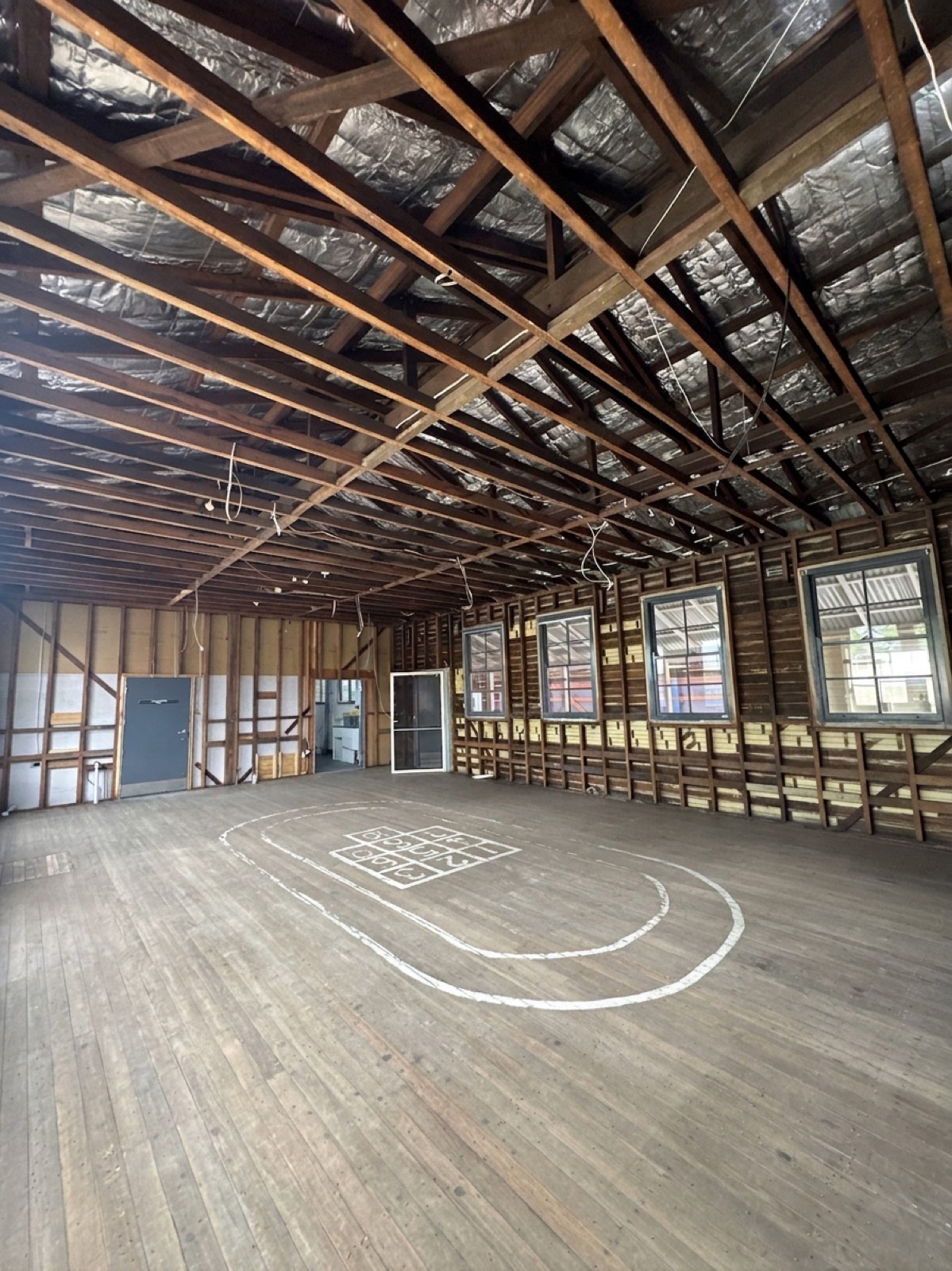 Heritage school hall stripped to timber frame, Newcastle