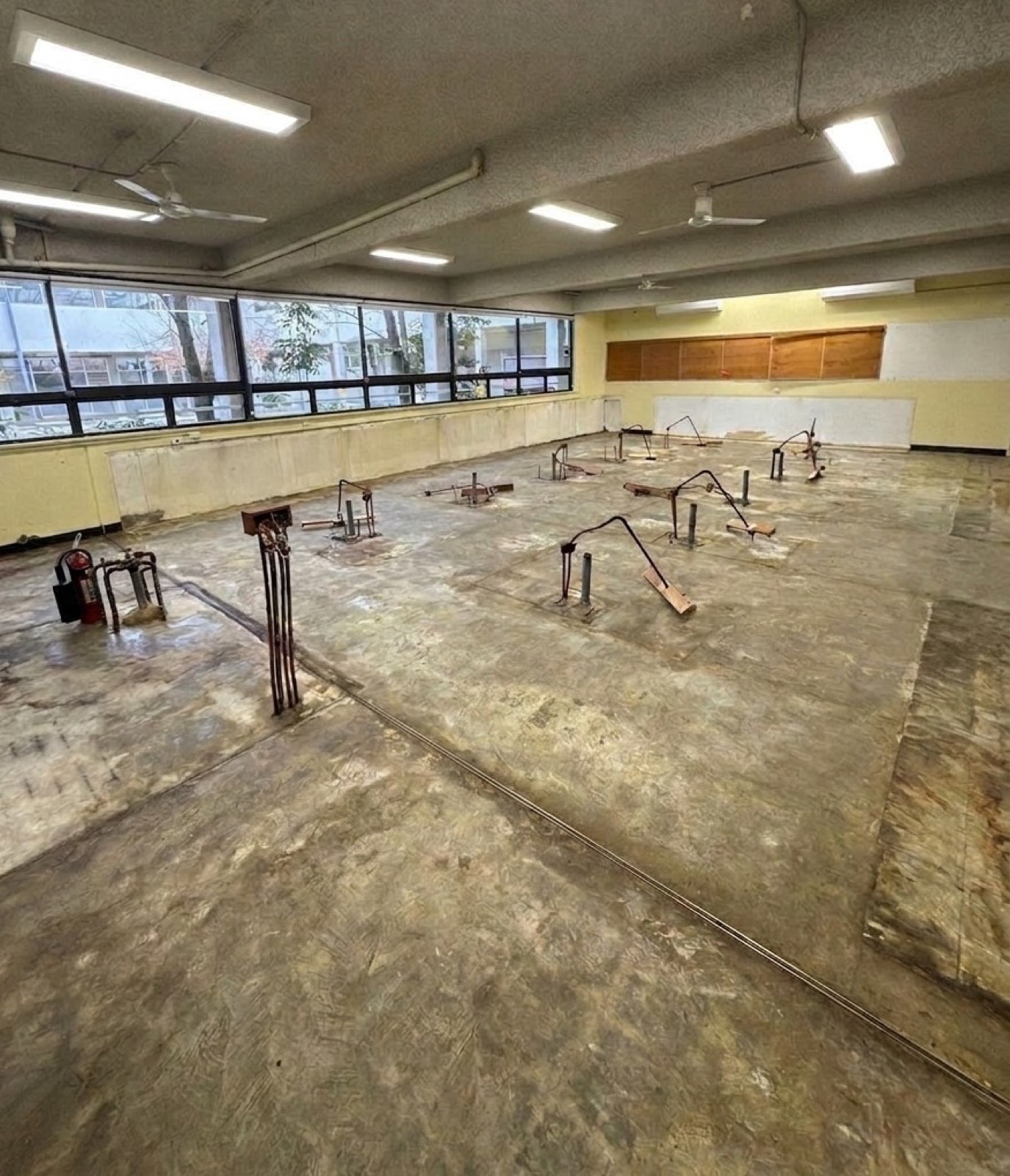 Classroom cleared to bare slab after asbestos vinyl removal, Randwick High School