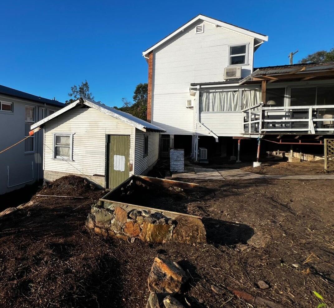 Residence with works complete and grounds cleared after friable asbestos removal